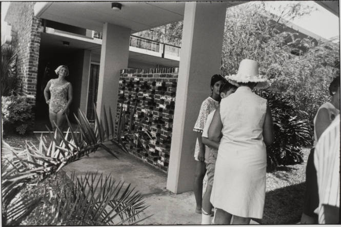 Untitled, from Women are Beautiful [Woman in Bathing Suit Leaving Motel]