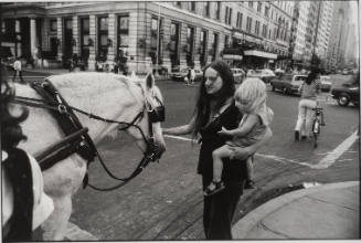 Untitled, from Women are Beautiful [Young Mother and Child Petting a Horse Near the Plaza Hotel]