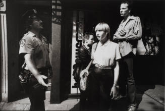 New York's "Ninth Precinct Police Station, is not all crime, some cops do public relations duties with local citizens, like these three punks hanging around the street corners"