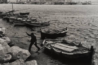 Fisherman jumping off the boat, Sicily, Italy