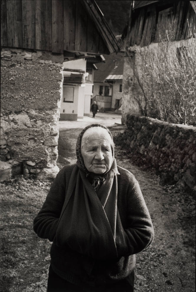 Elderly village woman with hands in pouch, Slovenia