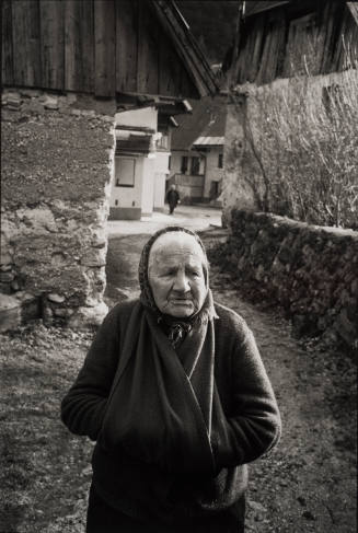 Elderly village woman with hands in pouch, Slovenia
