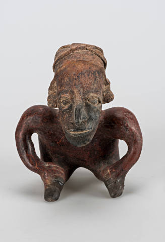 Seated figure with hunchback