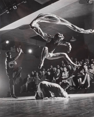Dancer-choreographer Charles Weidman with dancer Peter Hamilton dancing as fire over a victim in the choreographer's modern interpretive dance called "And Daddy Was a Fire," on Broadway, NY