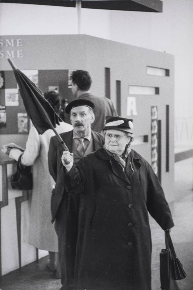 Woman gesturing with her umbrella, Brussels World Fair