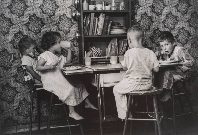 Children eating at kid's table