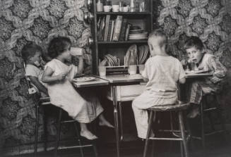 Children eating at kid's table