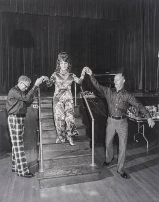 Two men help lady off of stage, Tri-Valley Area, Northern California, from Our Kind of People: American Groups and Rituals, 1975