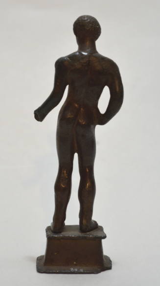 Naked athlete, with right hand on hip, left hand once held spear