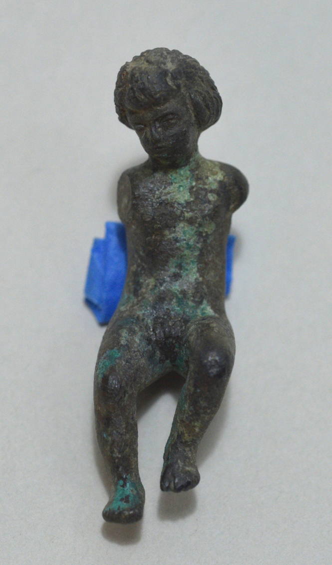 Seated figure of a boy