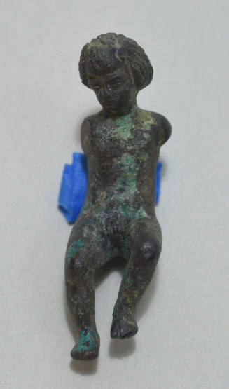 Seated figure of a boy