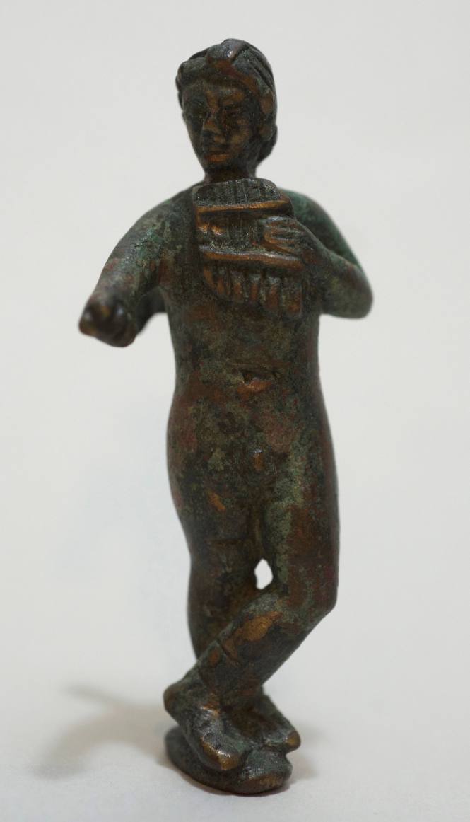 Figure of Eros playing the pipes