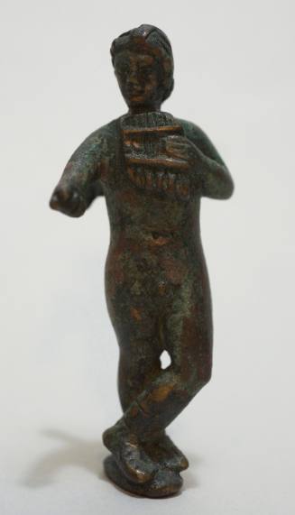 Figure of Eros playing the pipes