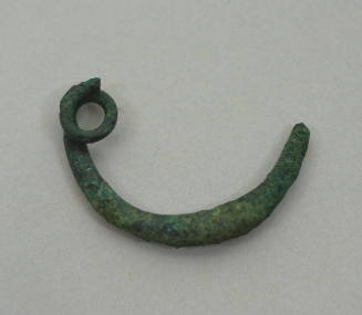 Fibula of simple bow type, ornamented with seven groups of fine incised lines