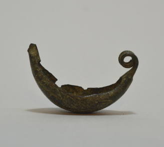 Fibula "a navicella," bow incised with large zigzag design