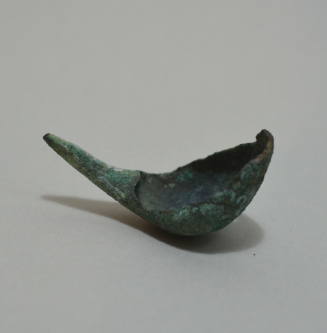 Fibula "a navicella," with incised lines and circles on bow
