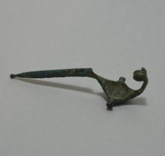Fibula "a navicella," with elongated pin, knobs at side of bow and end of catch, with triple spiral spring