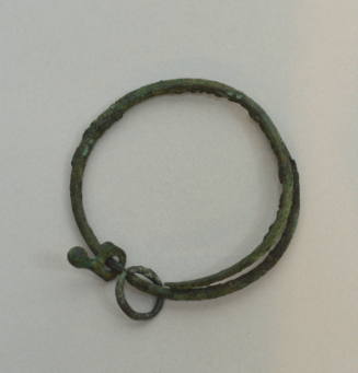 Armlet or bracelet with amulet and bronze ring pendants