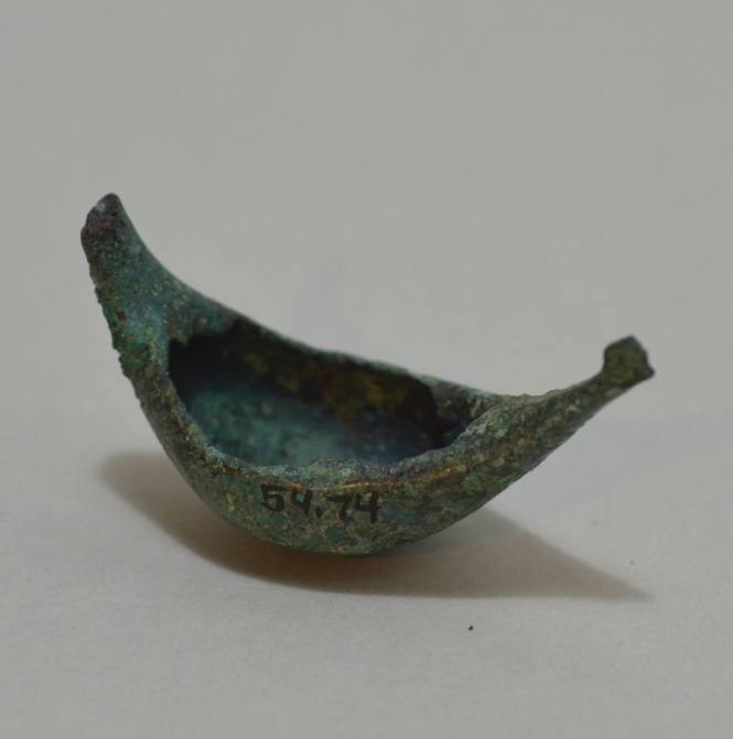 Fibula "a navicella," with impressed concentric circles and incised lines