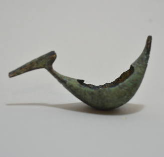 Boat fibula with elaborate incised decoration on exterior