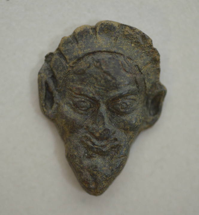 Appliqué of satyr head