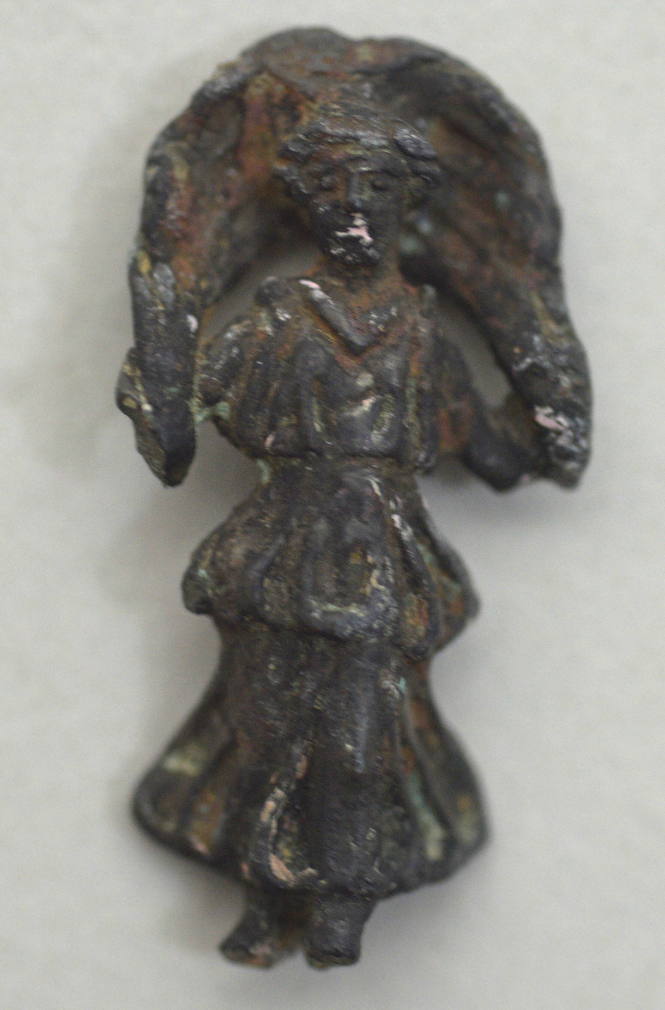 Miniature figurine of a nymph or goddess, her cloak billowing behind her head