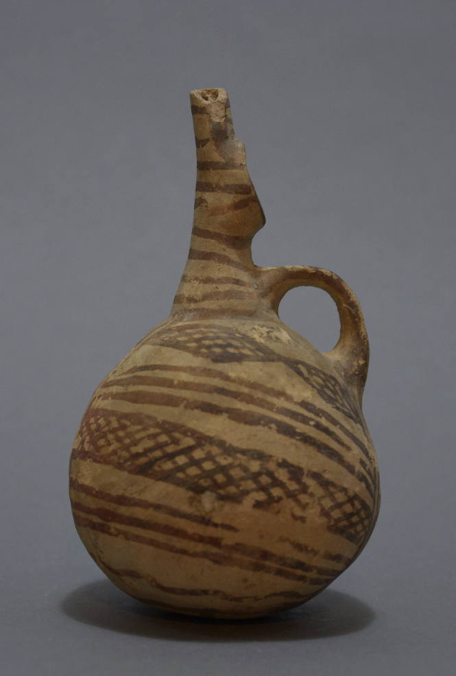 Cypriot buffware jug with beak - spout, linear and cross hatched decoration