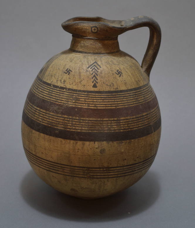 Cypriot oinochoe, with swastika and lozenge ornament on the shoulder, and eyes on spout