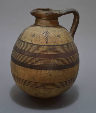 Cypriot oinochoe, with swastika and lozenge ornament on the shoulder, and eyes on spout