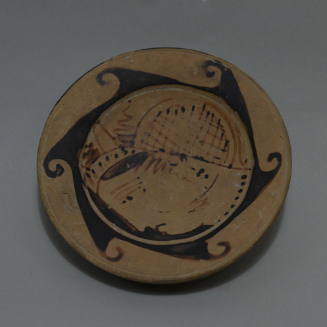 Faliscan high-footed plate, female head in profile with wave border
