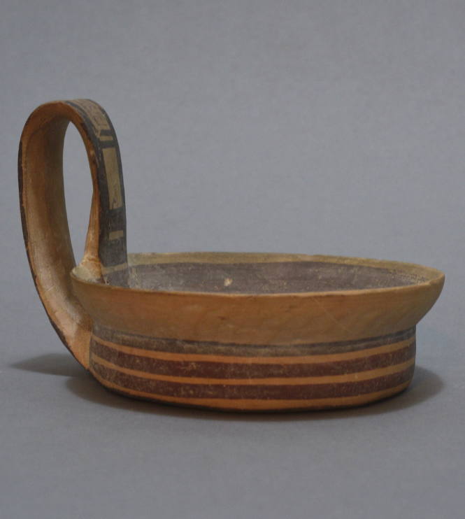Apulian bowl with high strap handle with geometic ornament