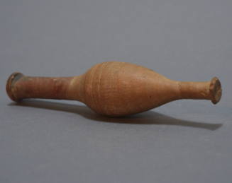 Spindle-shaped alabastron with narrow neck and swelling body, impressed rays around body