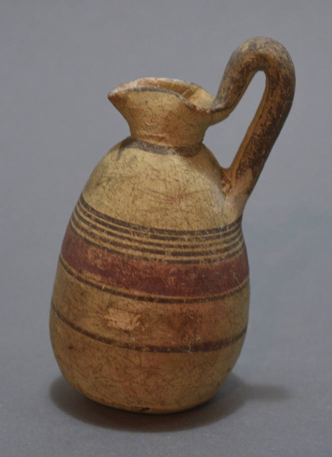 Cypriot oinochoe with pinched spout (trefoil lip) and encircling bands in red and brown paint
