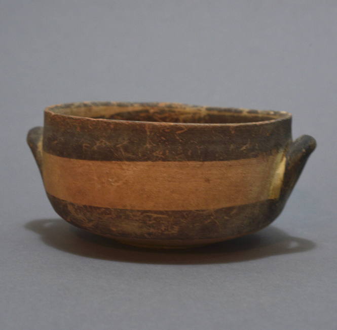 Kylix with angular profile, white painted ware, with wide brown bands; twin lateral handles