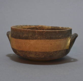 Kylix with angular profile, white painted ware, with wide brown bands; twin lateral handles