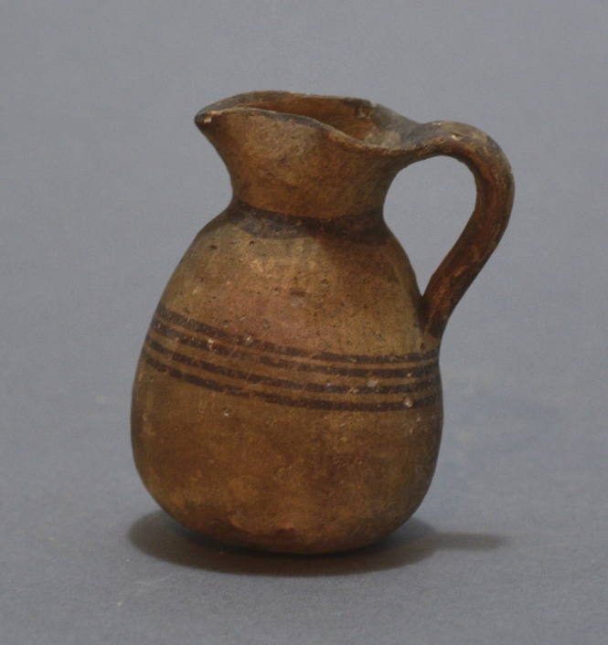 Juglet with pinched spout, brown bands of painted decoration