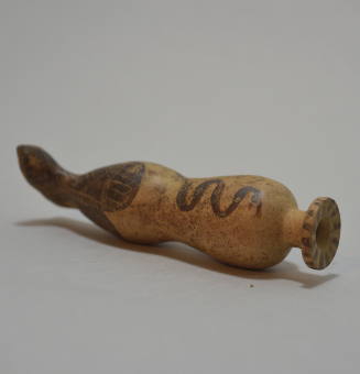 Corinthian Alabastron, black-figured, in the form of a stylized human leg with painted boot and snake ornament