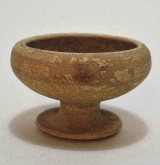 Footed up; buffware with dark glaze interior, 2 bands of decoration on exterior