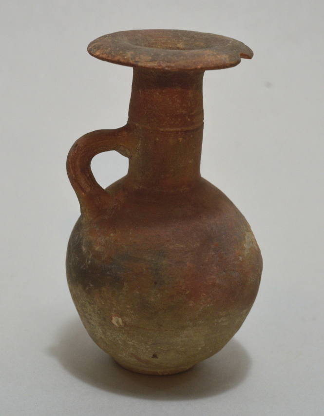 Small redware handle-ridge jug with broad rim