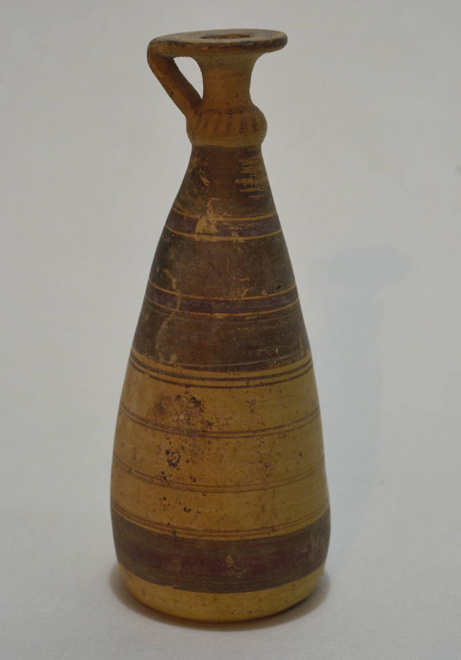 Italo-Corinthian pottery alabastron of conical form; with encircling bands