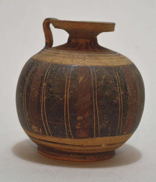 Italo-Corinthian round aryballos decorated with vertical panels