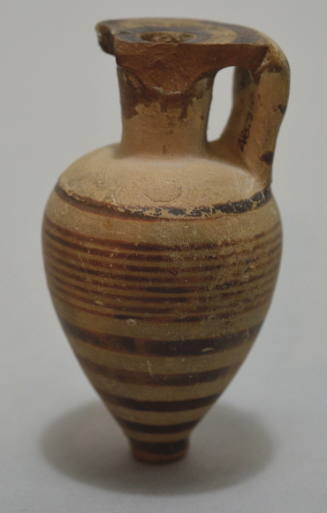 Italo-Corinthian pointed aryballos decorated with encircling black bands