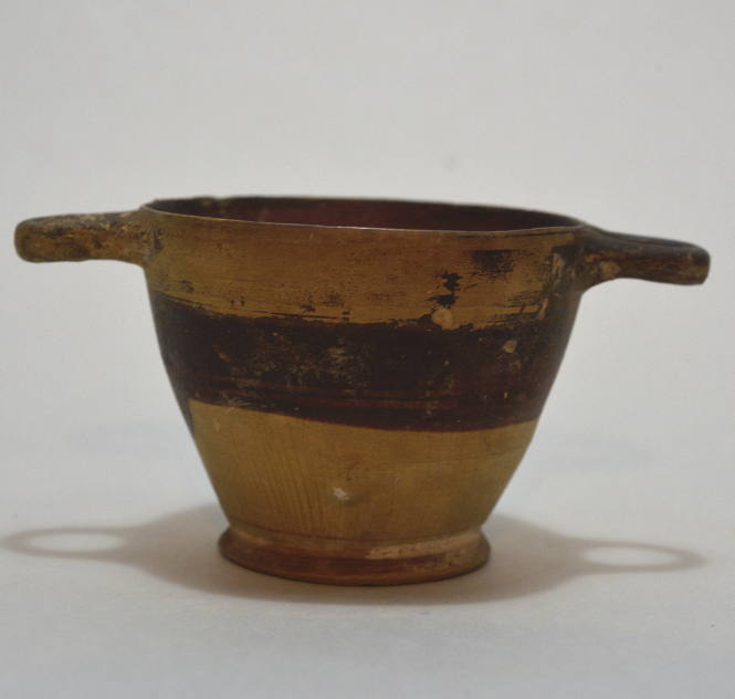 Skyphos with black painted decoration and rays above foot