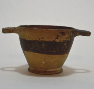 Skyphos with black painted decoration and rays above foot