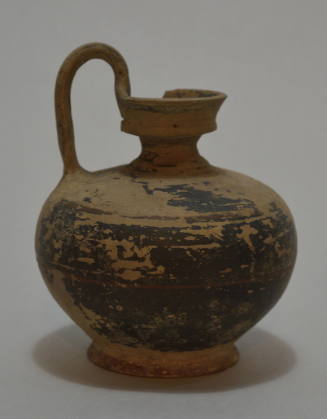 Balck-glazed jug with high handle, some band decoration