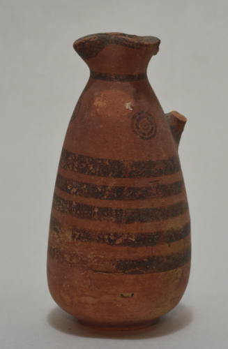 One-handled jug, with concentric circles and band decoration and trefoil lip