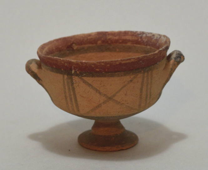 Cypriot Kylix with lateral handles, red and brown decoration, brown 'x' in the field