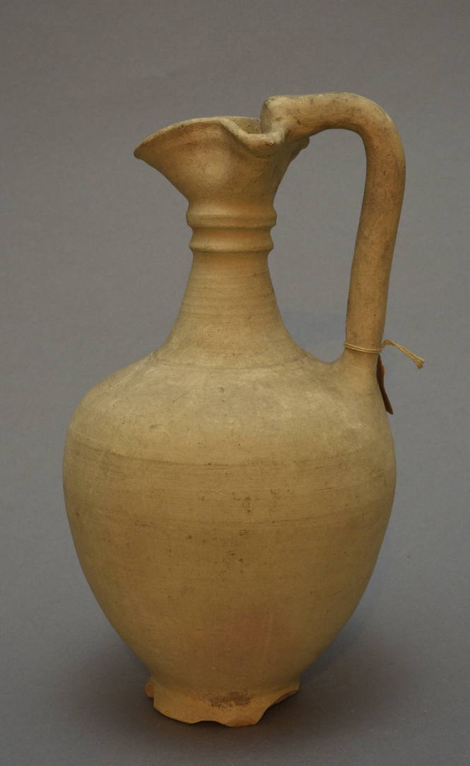 Trefoil-lipped oinochoe with raised concentric handle around neck; high slender handle