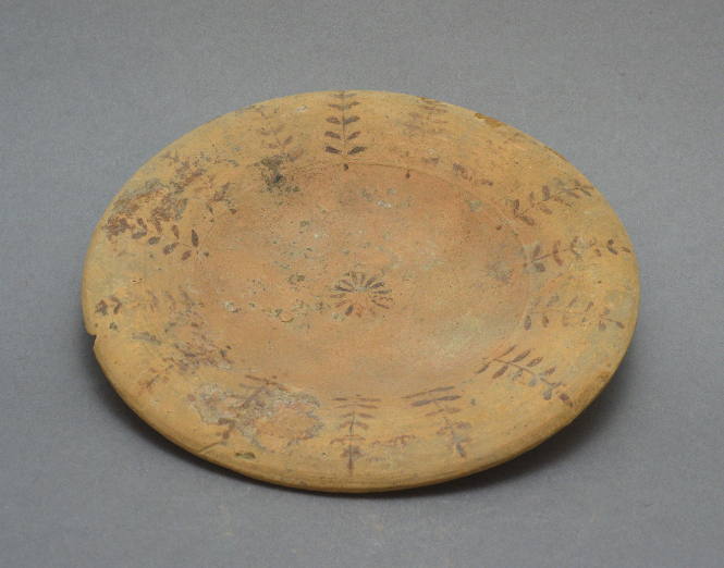 Plate; white-painted ware, ornament with radically-placed leaf design