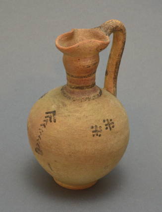 Pitcher with trefoil lip, bulbous neck; decorated with chevron column and cotted crosses